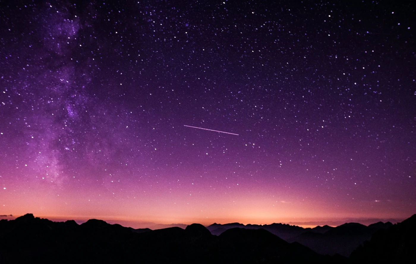 Starry sky over a mountain pass